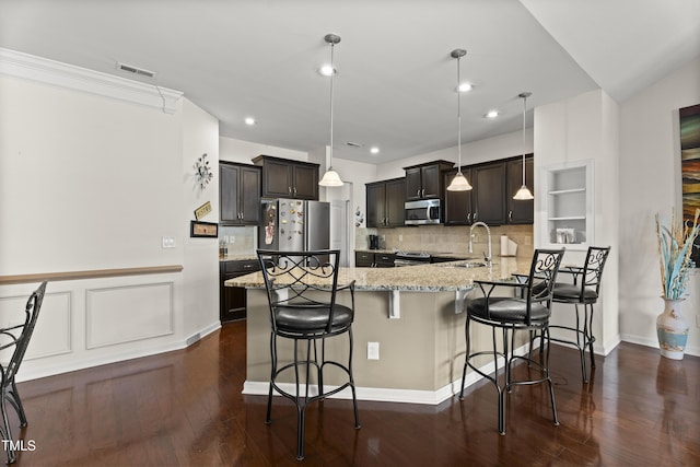 4612 Hanging Fern Ln, Raleigh, NC 27604 - kitchen with stainless steel appliances, light stone countertops, backsplash, a sink, and recessed lighting