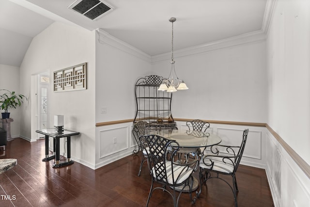4612 Hanging Fern Ln, Raleigh, NC 27604 - dining room with wood finished floors, a chandelier, lofted ceiling, a wainscoted wall, and ornamental molding