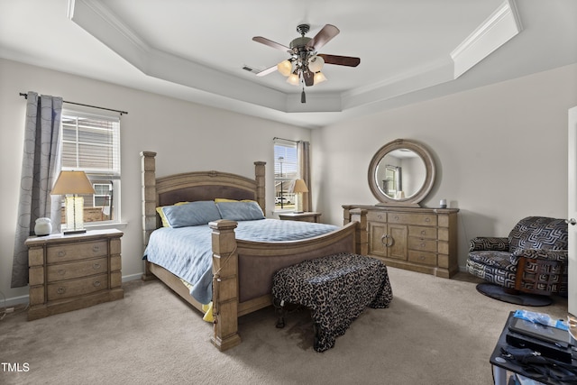 4612 Hanging Fern Ln, Raleigh, NC 27604 - carpeted bedroom featuring a tray ceiling, crown molding, ceiling fan, and baseboards