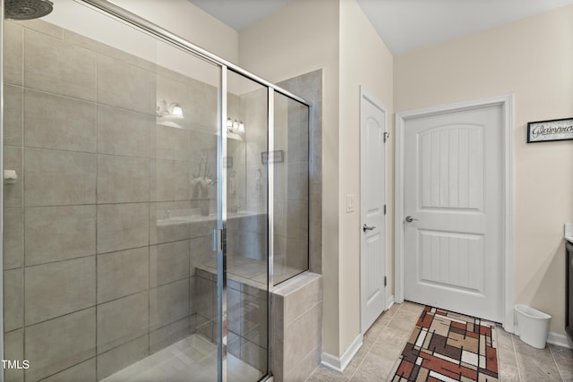 4612 Hanging Fern Ln, Raleigh, NC 27604 - bathroom with a shower stall, tile patterned floors, and baseboards