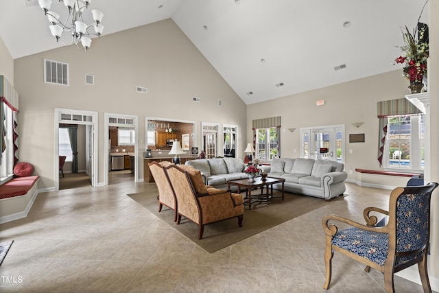 4612 Hanging Fern Ln, Raleigh, NC 27604 - living room with high vaulted ceiling, healthy amount of natural light, a chandelier, tile patterned flooring, and baseboards