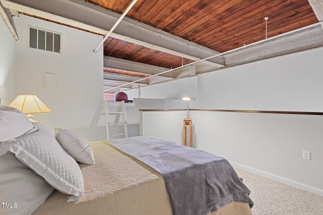 carpeted bedroom featuring baseboards and wooden ceiling