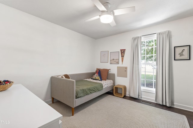 5413 Lower Creek Ct, Apex, NC 27539 - bedroom with baseboards, dark wood finished floors, and a ceiling fan