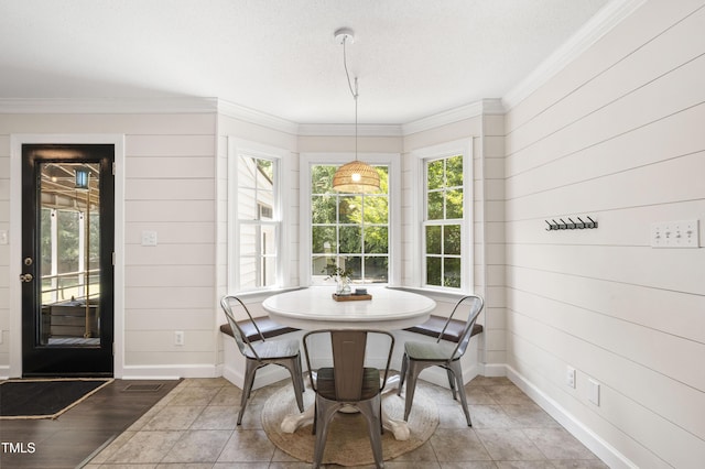 5413 Lower Creek Ct, Apex, NC 27539 - dining space featuring baseboards, crown molding, and wooden walls