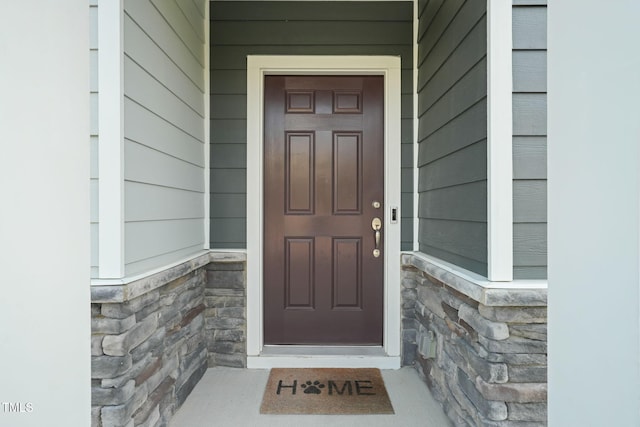 6618 Perry Creek Rd, Raleigh, NC 27616 - view of exterior entry with stone siding and covered porch
