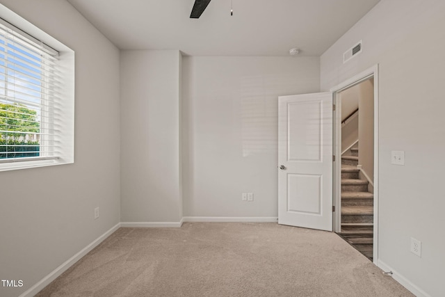 6618 Perry Creek Rd, Raleigh, NC 27616 - unfurnished bedroom featuring carpet flooring, baseboards, and a ceiling fan