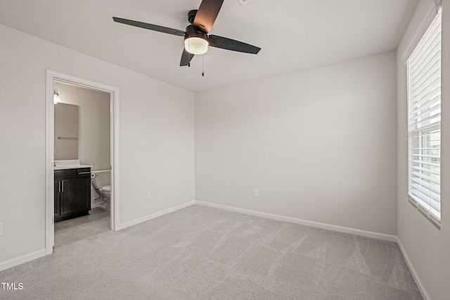 6618 Perry Creek Rd, Raleigh, NC 27616 - unfurnished bedroom featuring light carpet, multiple windows, and baseboards