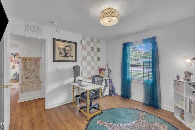 office space featuring wood finished floors and baseboards
