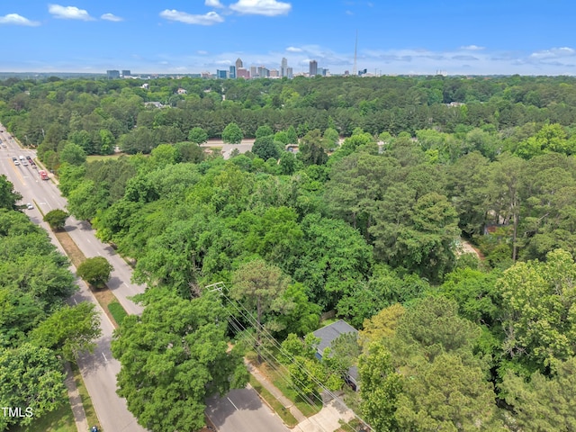 view of urban area with a forest