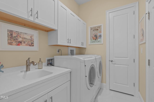 2511 Range Overlook Xing, Apex, NC 27523 - washroom featuring cabinet space, independent washer and dryer, and light tile patterned floors