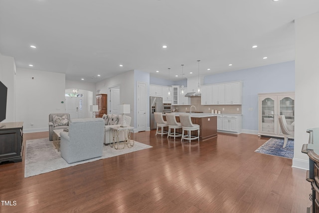 2511 Range Overlook Xing, Apex, NC 27523 - living room featuring dark wood finished floors and recessed lighting