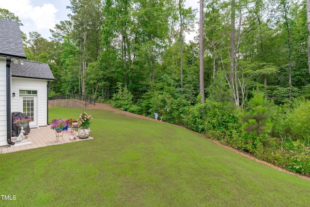 2511 Range Overlook Xing, Apex, NC 27523 - view of green lawn with a patio