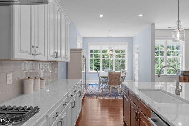 2511 Range Overlook Xing, Apex, NC 27523 - kitchen with dark wood-type flooring, appliances with stainless steel finishes, healthy amount of natural light, recessed lighting, and light stone counters