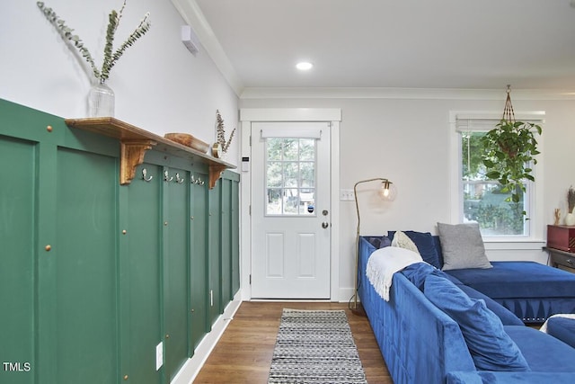mudroom featuring wood finished floors, crown molding, and recessed lighting