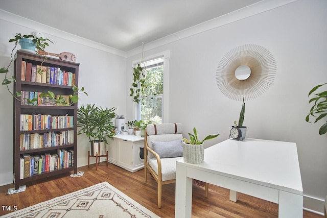 home office featuring wood finished floors and crown molding