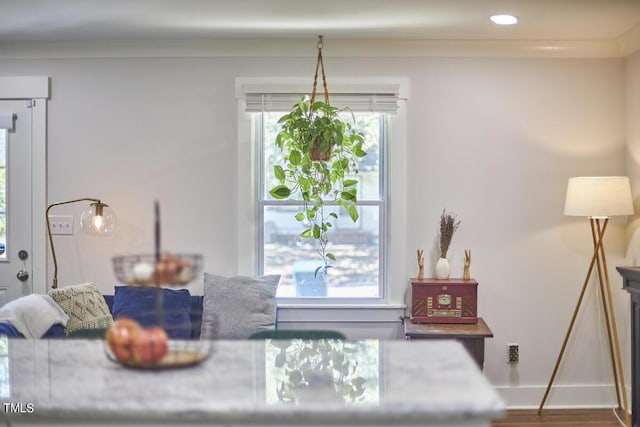 dining area featuring baseboards and wood finished floors