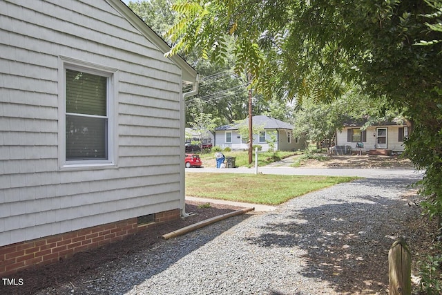 view of home's exterior featuring crawl space and a residential view