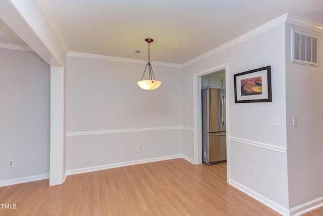2222 Pathway Dr, Chapel Hill, NC 27516 - spare room featuring light wood-style floors and ornamental molding