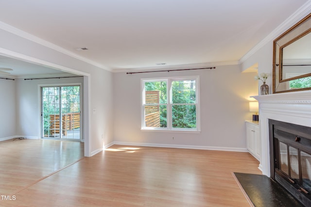 2222 Pathway Dr, Chapel Hill, NC 27516 - unfurnished living room featuring a fireplace with flush hearth, light wood-style flooring, and crown molding