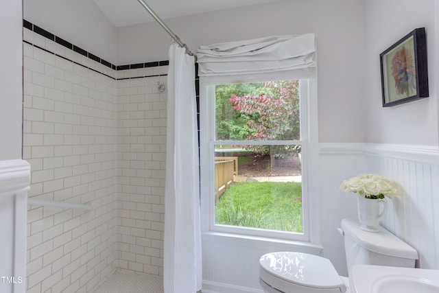 2222 Pathway Dr, Chapel Hill, NC 27516 - full bathroom with a tile shower and a wainscoted wall