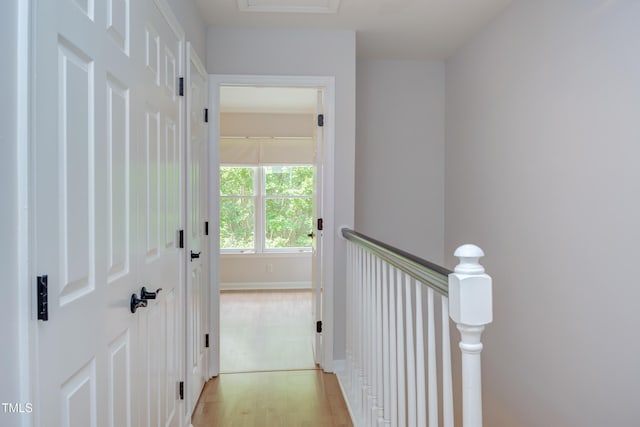 2222 Pathway Dr, Chapel Hill, NC 27516 - corridor featuring light wood-style flooring and an upstairs landing