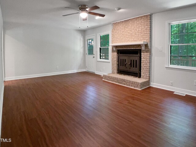 1104 Theresa Ct, Raleigh, NC 27615 - unfurnished living room featuring dark wood-type flooring, ceiling fan, and baseboards