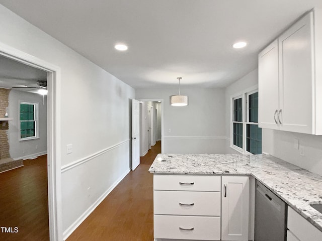 1104 Theresa Ct, Raleigh, NC 27615 - kitchen featuring dishwasher, a peninsula, white cabinetry, dark wood-style flooring, and light stone countertops