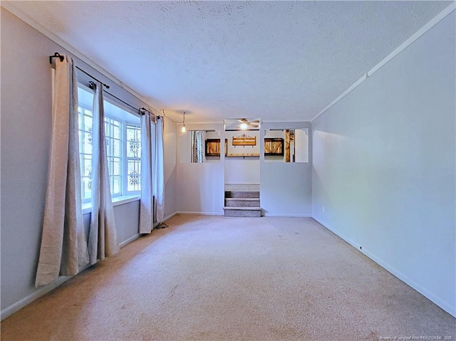 6261 Stoney Point Loop, Fayetteville, NC 28306 - unfurnished living room with a textured ceiling, carpet flooring, and baseboards