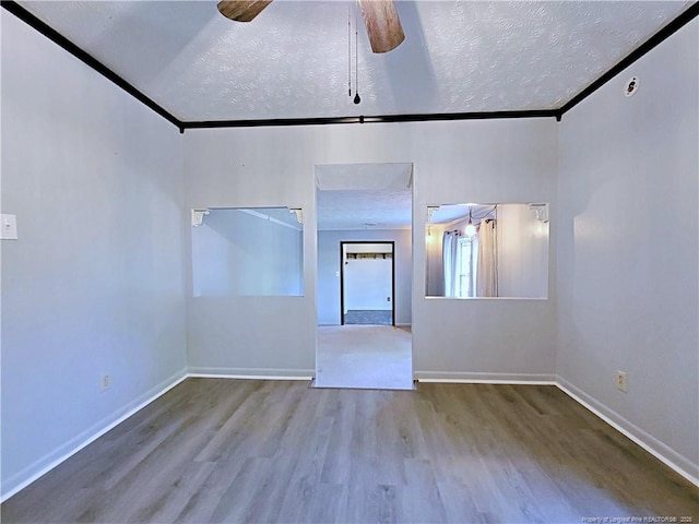 6261 Stoney Point Loop, Fayetteville, NC 28306 - unfurnished room with a ceiling fan, wood finished floors, a textured ceiling, and baseboards