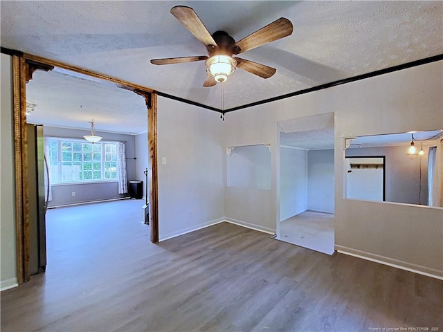 6261 Stoney Point Loop, Fayetteville, NC 28306 - spare room featuring wood finished floors, a textured ceiling, ceiling fan, and baseboards