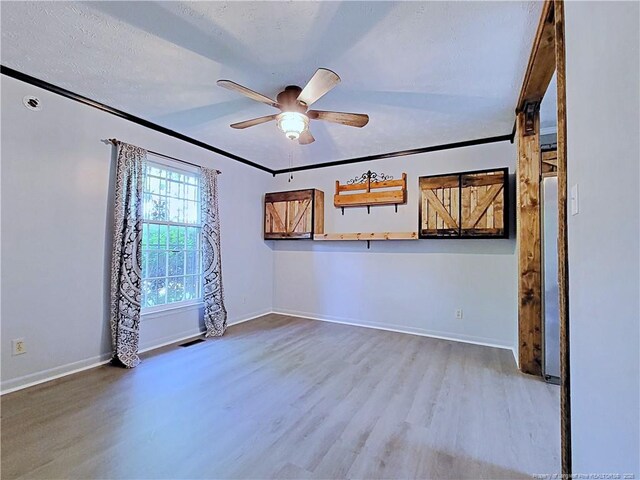 6261 Stoney Point Loop, Fayetteville, NC 28306 - unfurnished room with wood finished floors, ceiling fan, and baseboards