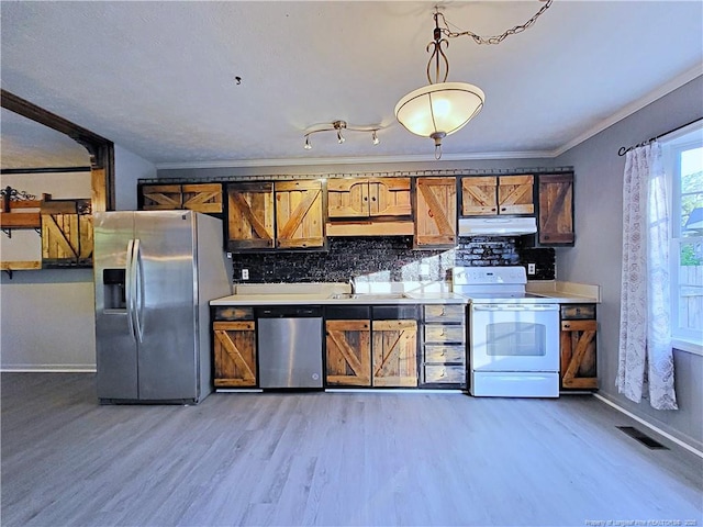 6261 Stoney Point Loop, Fayetteville, NC 28306 - kitchen featuring appliances with stainless steel finishes, under cabinet range hood, a sink, baseboards, and backsplash