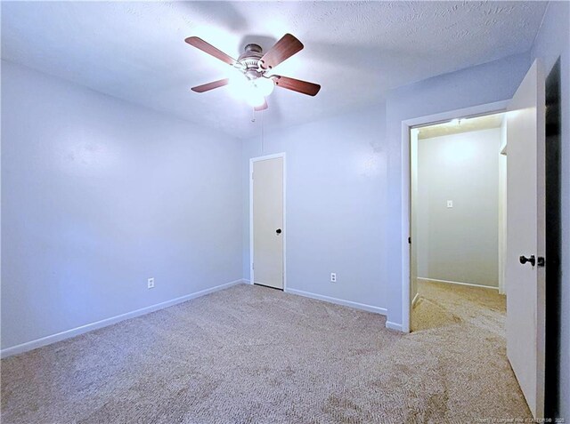 6261 Stoney Point Loop, Fayetteville, NC 28306 - unfurnished bedroom with carpet flooring, baseboards, and ceiling fan