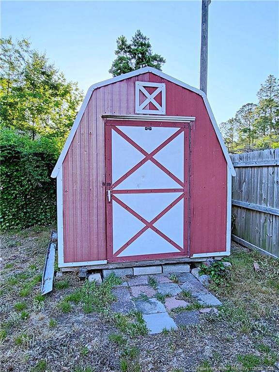 6261 Stoney Point Loop, Fayetteville, NC 28306 - view of shed featuring fence