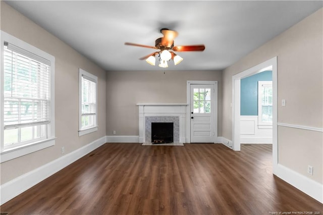 1001 N Orange Ave, Dunn, NC 28334 - unfurnished living room with a fireplace with flush hearth, a ceiling fan, dark wood finished floors, and baseboards