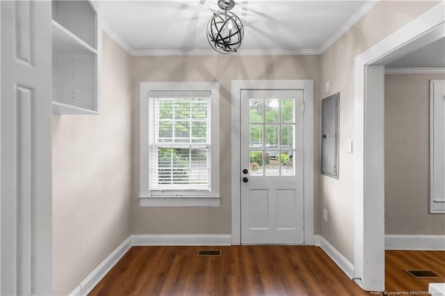 1001 N Orange Ave, Dunn, NC 28334 - doorway featuring electric panel, dark wood-type flooring, crown molding, and baseboards