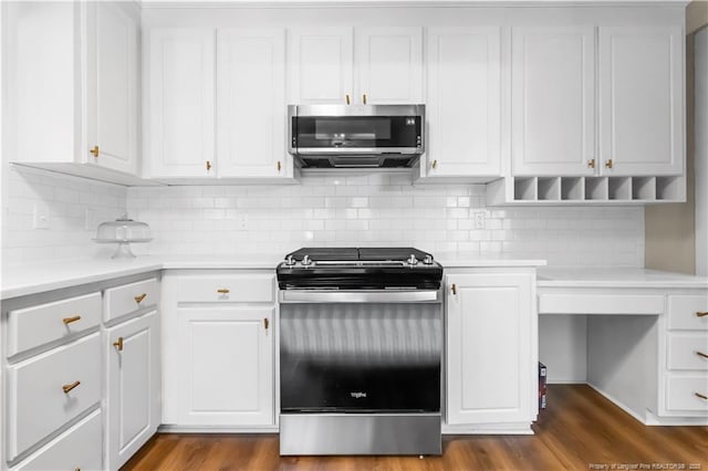 1001 N Orange Ave, Dunn, NC 28334 - kitchen featuring appliances with stainless steel finishes, light countertops, white cabinetry, and dark wood-style floors