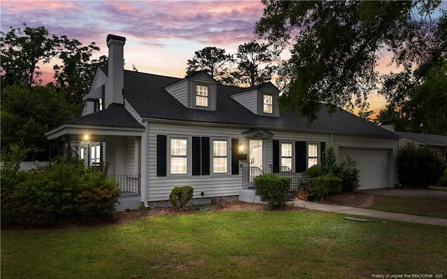1001 N Orange Ave, Dunn, NC 28334 - cape cod home featuring a garage, a yard, a chimney, driveway, and roof with shingles
