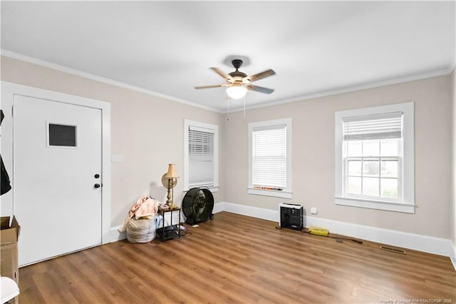 1001 N Orange Ave, Dunn, NC 28334 - entrance foyer with light wood-type flooring, ceiling fan, ornamental molding, and baseboards