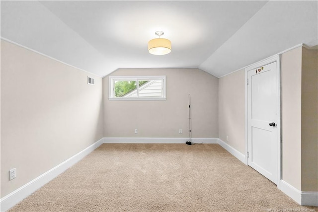 1001 N Orange Ave, Dunn, NC 28334 - bonus room featuring baseboards, carpet, and vaulted ceiling