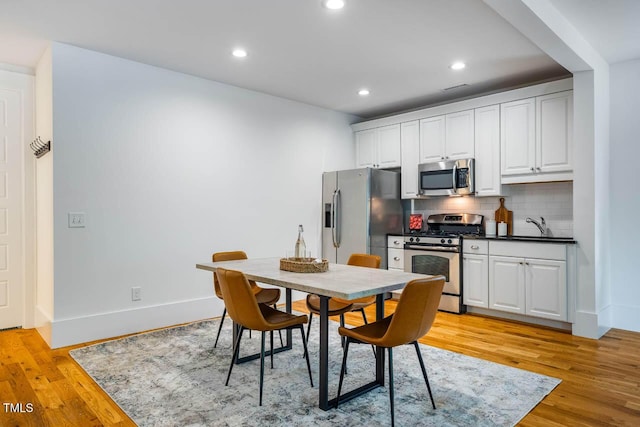 253 Tobacco Farm Way, Chapel Hill, NC 27516 - dining room with light wood-type flooring, recessed lighting, and baseboards