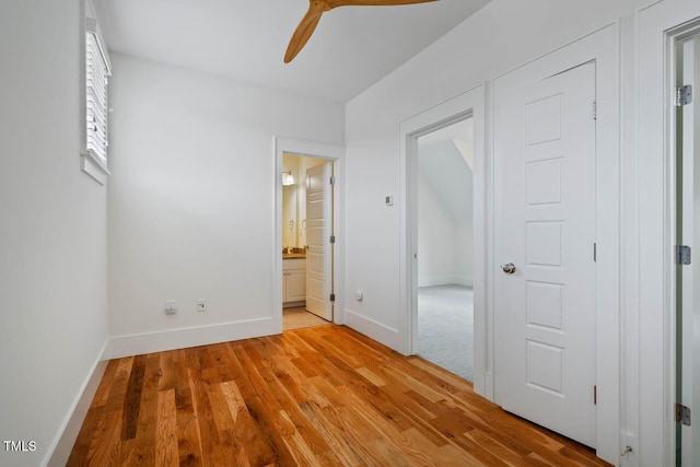 253 Tobacco Farm Way, Chapel Hill, NC 27516 - unfurnished bedroom featuring light wood-type flooring, baseboards, ensuite bath, and a ceiling fan