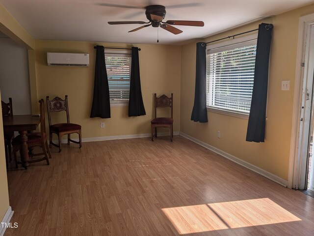 3405 Ode Turner Rd, Hillsborough, NC 27278 - sitting room with a wall mounted air conditioner, wood finished floors, a ceiling fan, and baseboards