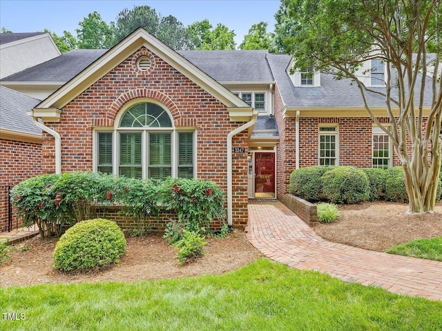 3347 Ridgecrest Ct, Raleigh, NC 27607 - view of front facade featuring brick siding and a shingled roof