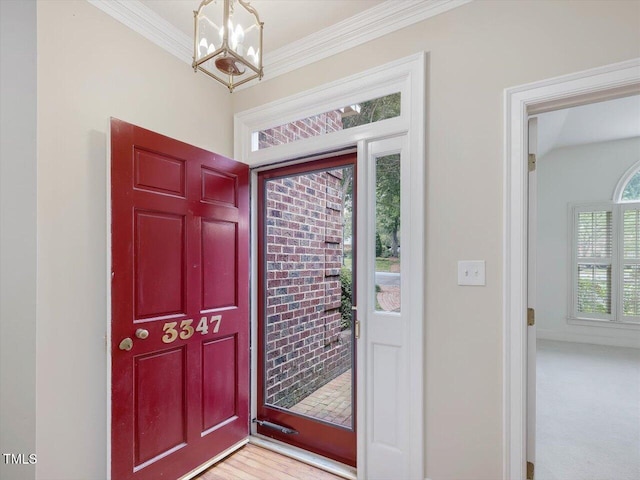 3347 Ridgecrest Ct, Raleigh, NC 27607 - entryway featuring a chandelier and crown molding