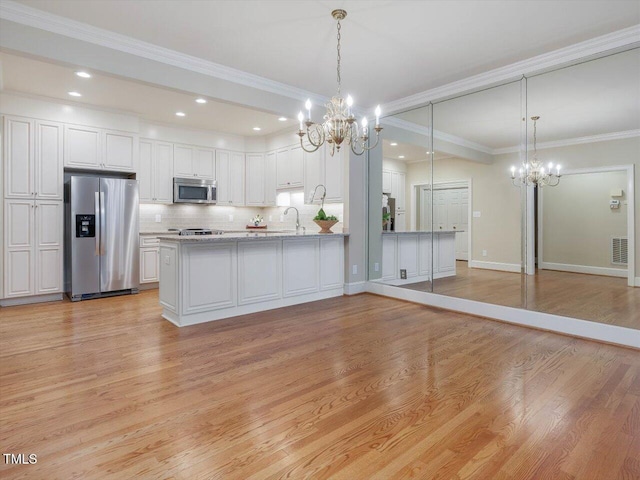 3347 Ridgecrest Ct, Raleigh, NC 27607 - kitchen featuring appliances with stainless steel finishes, a chandelier, a sink, backsplash, and recessed lighting