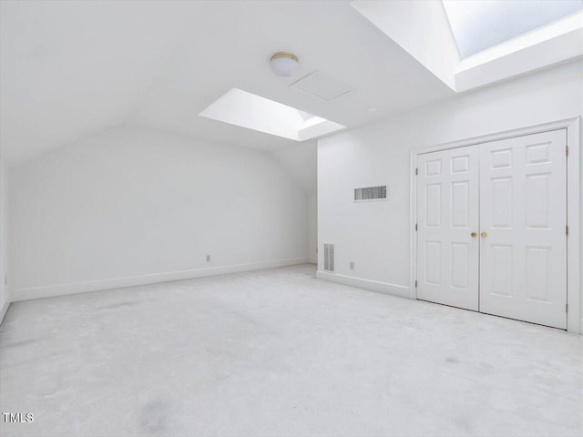 3347 Ridgecrest Ct, Raleigh, NC 27607 - additional living space featuring a skylight, vaulted ceiling, carpet flooring, and baseboards