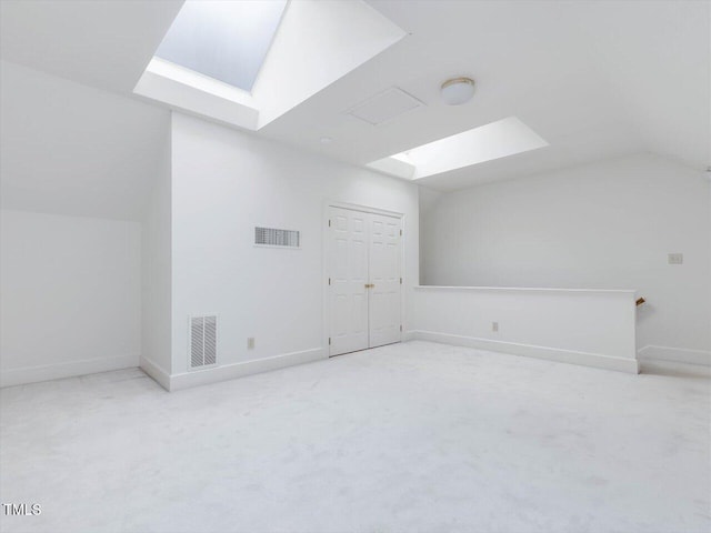 3347 Ridgecrest Ct, Raleigh, NC 27607 - bonus room featuring a skylight, vaulted ceiling, carpet, and baseboards