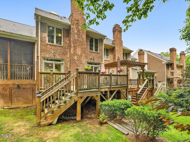 3347 Ridgecrest Ct, Raleigh, NC 27607 - rear view of house featuring stairway, a deck, brick siding, and a chimney