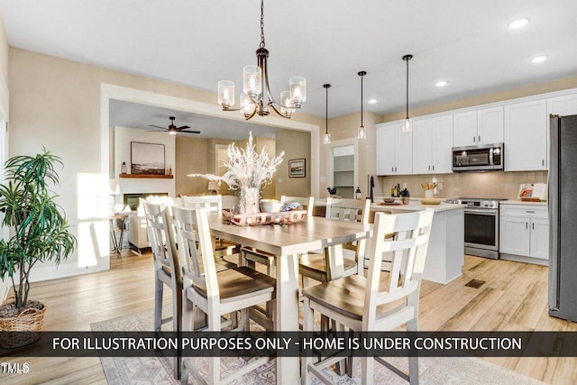 dining area featuring a chandelier, light wood-style floors, recessed lighting, and ceiling fan